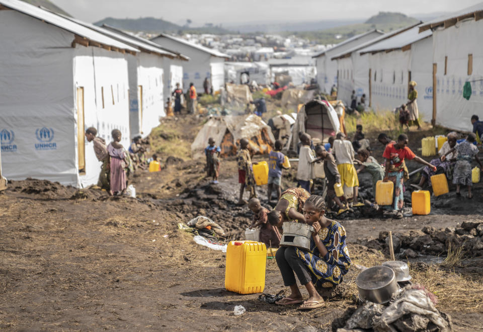 FILE - People displaced by the ongoing fighting between Congolese forces and M23 rebels gather in a camp on the outskirts of Goma, Democratic Republic of Congo, Wednesday, March 13, 2024. The U.N. human rights chief says the world is forgetting the escalating violence in eastern Congo as conflicts continue in places like Ukraine and Gaza. He visited the region and called for peace and support for millions repeatedly displaced. Eastern Congo has long been overrun by more than 120 armed groups seeking to control the region’s rich resources as they carry out mass killings. (AP Photo/Moses Sawasawa, File)