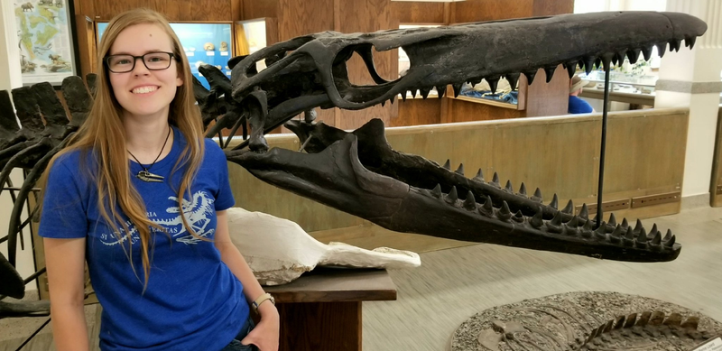 Amelia Zietlow with a cast of Mosasaurus conodon at the South Dakota School of Mines & Technology in Rapid City, SD.