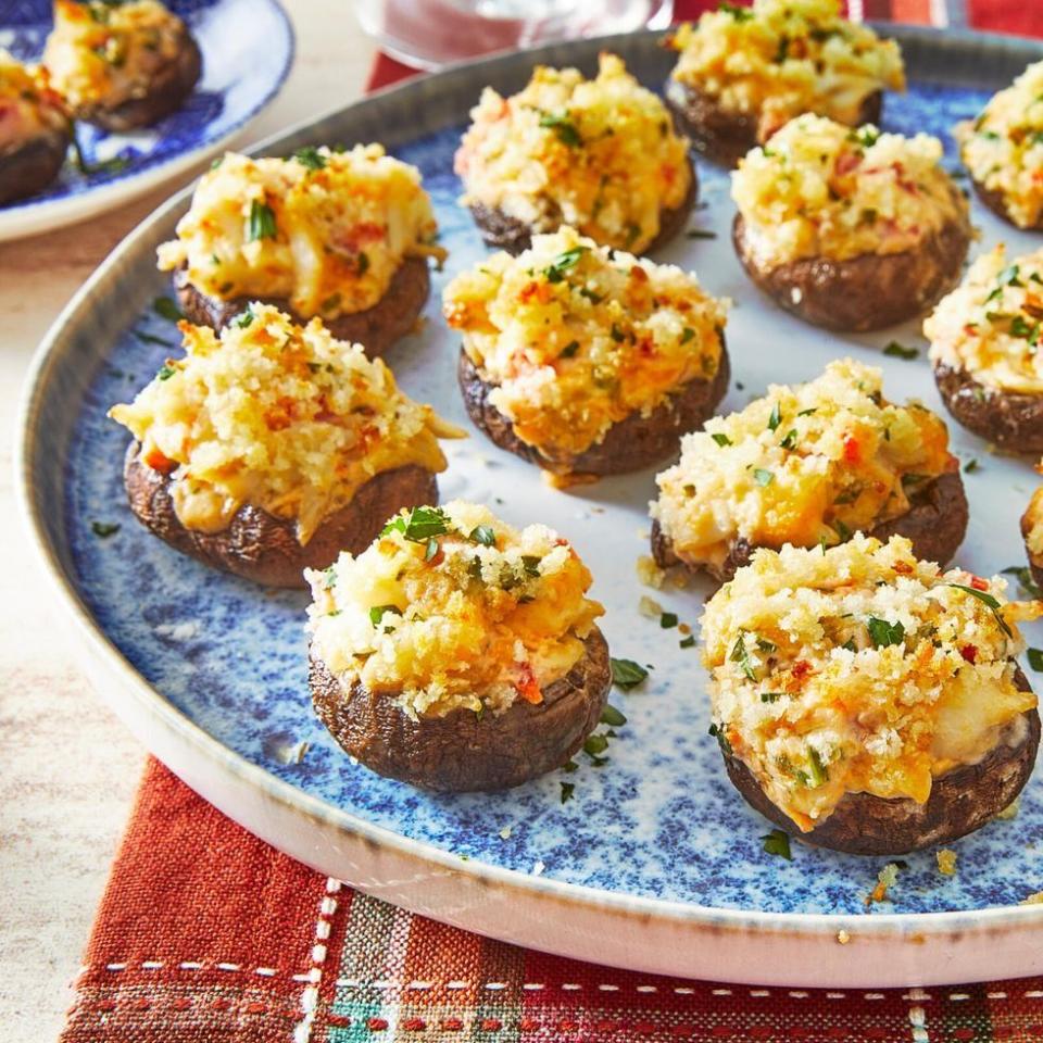 crab stuffed mushrooms on blue plate