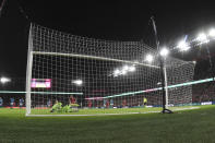 Charlotte FC goalkeeper Pablo Sisniega, front left, is unable to stop a goal by St. Louis City SC midfielder Eduard Lowen, front right, during the first half of an MLS soccer match Saturday, March 4, 2023, in St. Louis. (AP Photo/Joe Puetz)