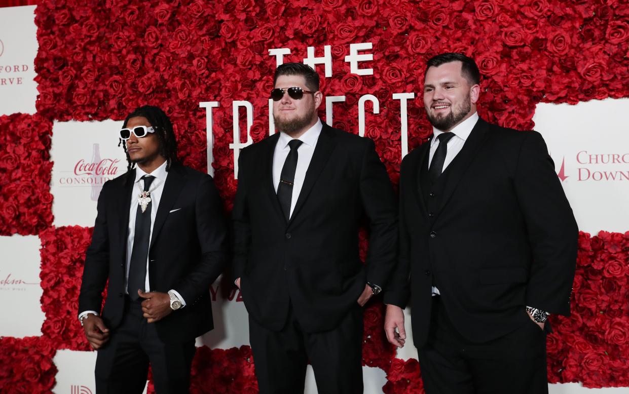 (L-R). Kansas City Chiefs football players Isiah "Pop" Pacheco, Creed Humphrey and Mike Caliendo arrive on the red carpet during the Trifecta Gala in Louisville, Ky. on May. 3, 2024.