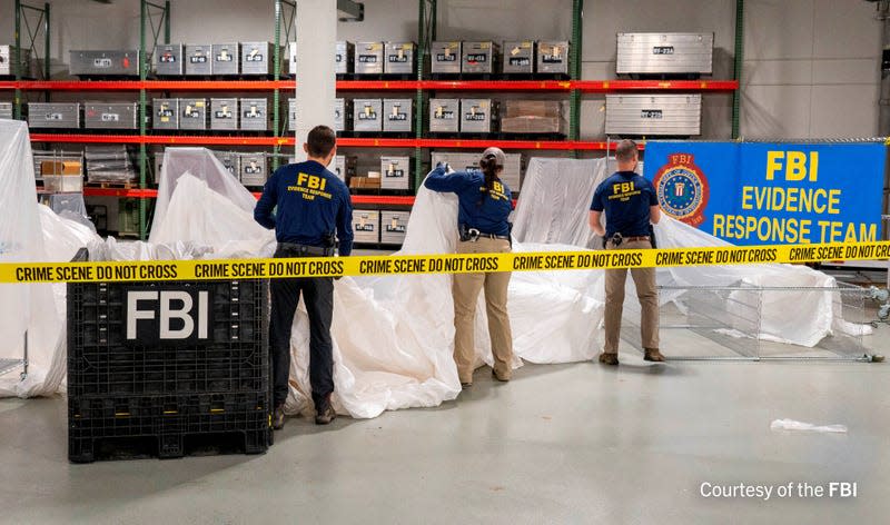 An undated U.S. Federal Bureau of Investigation handout photo taken at an undisclosed location shows FBI Special Agents assigned to the bureau’s Evidence Response Team processing material recovered from the high-altitude Chinese balloon that was shot down by a U.S. military jet off the coast of South Carolina, in this image released by the FBI on February 9, 2023. 