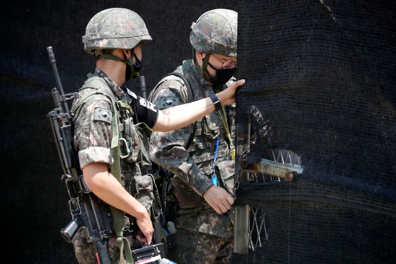 South Korean soldiers check an entrance of their guard post near the demilitarized zone separating the two Koreas in Paju