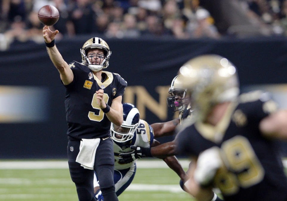 FILE - In this Sunday, Nov. 4, 2018, file photo, New Orleans Saints quarterback Drew Brees (9) throws a pass in the first half of an NFL football game against the Los Angeles Rams in New Orleans. Brees and the high-powered Saints face an historically bad defense at Paul Brown Stadium on Sunday. The Bengals have allowed more than 500 yards in each of the last two games. (AP Photo/Bill Feig, File)