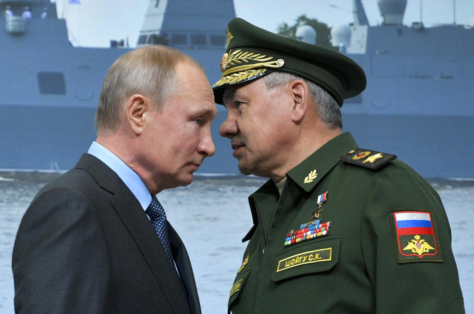 FILE In this file photo taken on Tuesday, April 23, 2019, Russian President Vladimir Putin, left, and Russian Defense Minister Sergei Shoigu during a visit a shipyard in St. Petersburg, Russia. Russian President Vladimir Putin prepares to mark his 20th year in power, as the longest-serving leader since Joseph Stalin. (Alexei Druzhinin, Sputnik, Kremlin Pool Photo via AP, File)