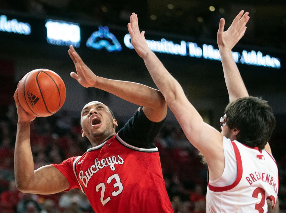 Ohio State's Zed Key, left, is defended by Nebraska's Wilhelm Breidenbach during the second half of an NCAA college basketball game Wednesday, Jan. 18, 2023, in Lincoln, Neb. (Justin Wan/Lincoln Journal Star via AP)