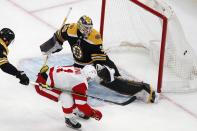 Detroit Red Wings' Filip Zadina (11) scores on Boston Bruins' Linus Ullmark (35) during the second period of an NHL hockey game Tuesday, Nov. 30, 2021, in Boston. (AP Photo/Michael Dwyer)