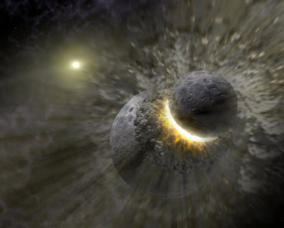 Two gray colored spheres collide to form a circular spray of gray material and a bright yellow semi-circle at the point where they connect.