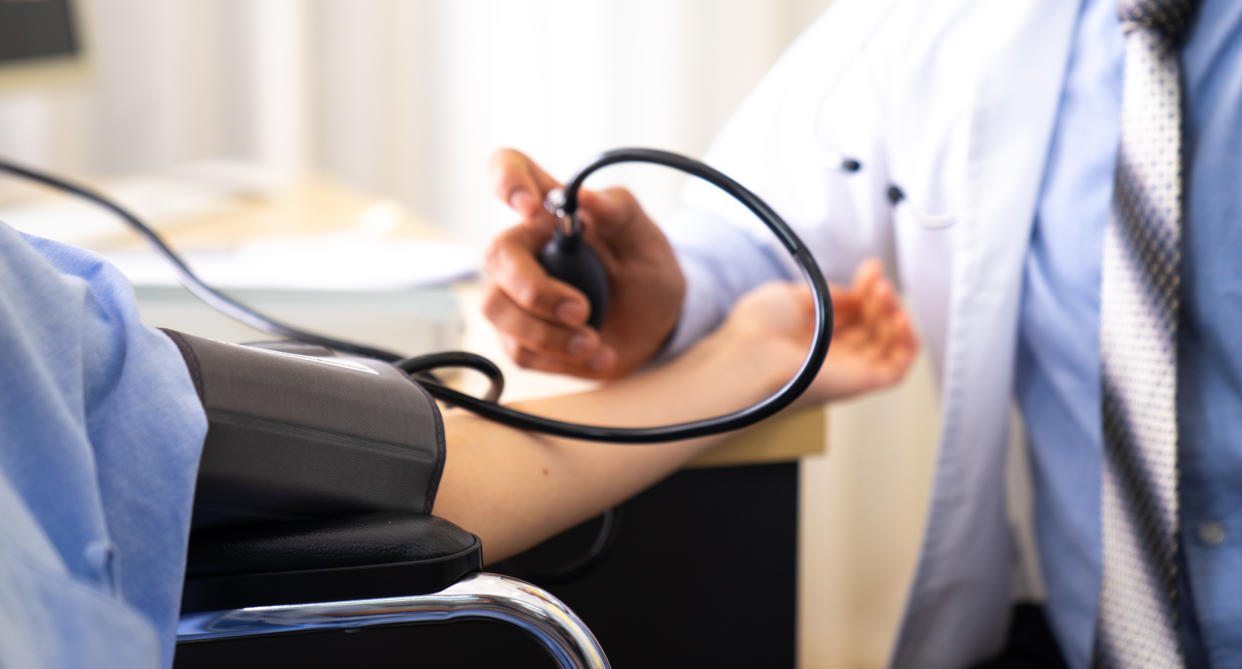 A man having his blood pressure taken