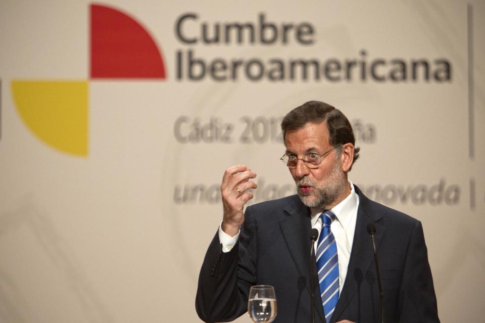 Spain's Prime Minister Mariano Rajoy, gestures during a press conference at the XXII Iberoamerican summit in the southern Spanish city of Cadiz, Saturday, Nov. 17, 2012. In an historic role reversal, recession-hit Spain and Portugal on Friday courted the Latin American leaders of their former colonies, countries that now enjoy some of the strongest economic growth in the world. Spain's King Juan Carlos opened the annual Iberoamerican summit, which brings together the heads of Spain and Portugal and the leaders of Latin America to discuss political issues and arrange business deals. (AP Photo/Miguel Angel Morenatti)