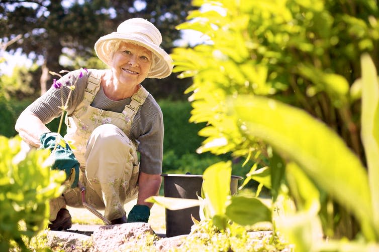 An older woman gardening