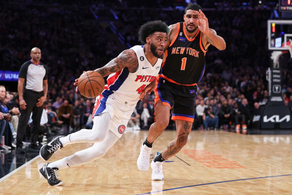 Pistons forward Saddiq Bey dribbles against Knicks forward Obi Toppin during the first half on Friday, Nov. 11, 2022, at Madison Square Garden.