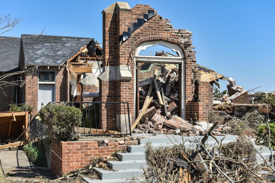 What remains of the Chapel of the Cross Episcopal Church is seen in Rolling Fork on Sunday.