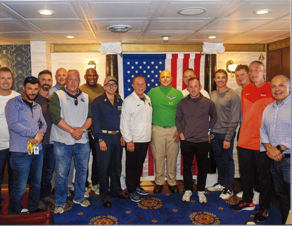 Several Michigan State men’s coaches pose on the USS Carl Vinson last week: including Tom Izzo center), Mel Tucker (back row, left), Jake Boss (front row left), Casey Lubahn (front row, right), Doug Wojcik (back row, right) and Adam Nightingale (back row, left). Left of Izzo is Command Master Chief Israel Pedregon. Right of Izzo is Captain Erik Kenny.