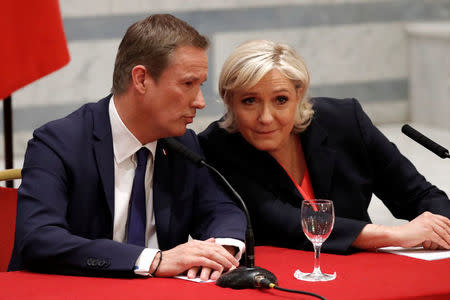 Marine Le Pen French National Front (FN) political party leader and candidate for French 2017 presidential election and Debout La France group former candidate Nicolas Dupont-Aignan attend a news conference in Paris, France, April 29, 2017. REUTERS/Charles Platiau