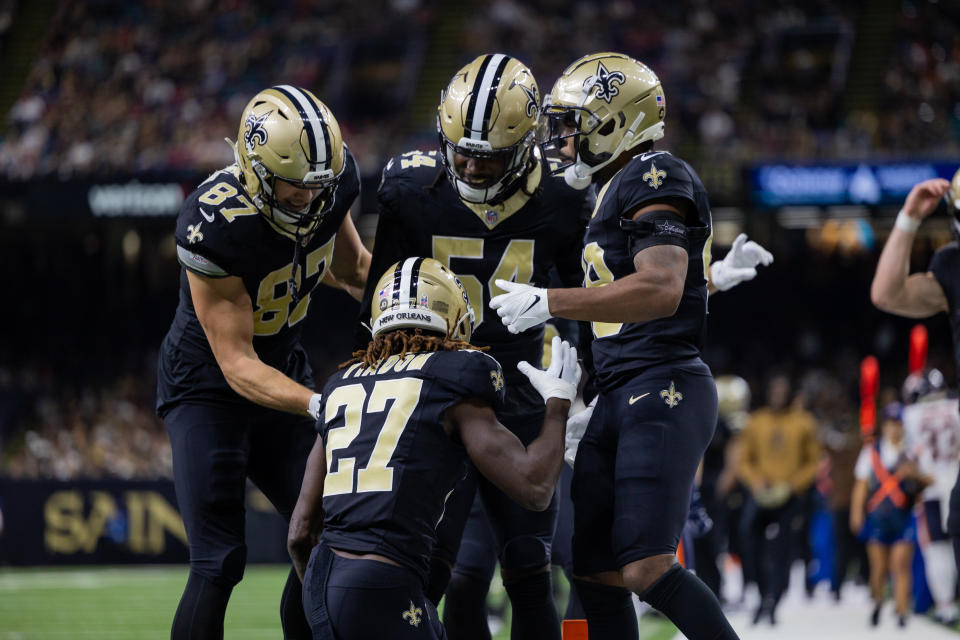 Nov 5, 2023; New Orleans, Louisiana, USA; New Orleans Saints cornerback Isaac Yiadom (27) is congratulated by tight end <a class="link " href="https://sports.yahoo.com/nfl/players/31969" data-i13n="sec:content-canvas;subsec:anchor_text;elm:context_link" data-ylk="slk:Foster Moreau;sec:content-canvas;subsec:anchor_text;elm:context_link;itc:0">Foster Moreau</a> (87) and cornerback <a class="link " href="https://sports.yahoo.com/nfl/players/31886" data-i13n="sec:content-canvas;subsec:anchor_text;elm:context_link" data-ylk="slk:Lonnie Johnson Jr.;sec:content-canvas;subsec:anchor_text;elm:context_link;itc:0">Lonnie Johnson Jr.</a> (28) for downing a punt at the 1 yard line against the <a class="link " href="https://sports.yahoo.com/nfl/teams/chicago/" data-i13n="sec:content-canvas;subsec:anchor_text;elm:context_link" data-ylk="slk:Chicago Bears;sec:content-canvas;subsec:anchor_text;elm:context_link;itc:0">Chicago Bears</a> during the second half at the Caesars Superdome. Mandatory Credit: Stephen Lew-USA TODAY Sports