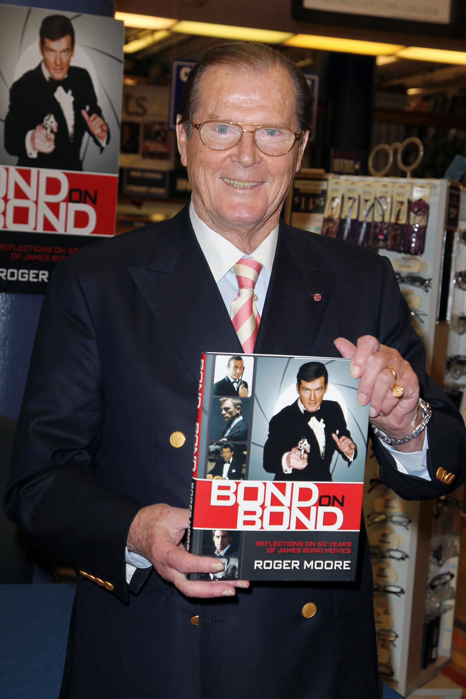 FILE - This Nov. 9, 2012 file image released by Starpix shows British actor Roger Moore at a signing for his book, "Bond On Bond: Reflections on 50 years of James Bond Movies," at Barnes and Noble in New York. Moore's recollections are cheeky and well informed. He includes snapshots of famous pals who showed up on set, details gadgetry and includes a great color beefcake shot of Daniel Craig. Moore, who was one of six actors who portrayed the super spy James Bond 007, starred in the films, "Live and Let Die," "A View to a Kill," "Octopussy," "Moonraker," "The Man with the Golden Gun," "For Your Eyes Only," and "The Spy Who Loved Me." (AP Photo/Starpix, Amanda Schwab)