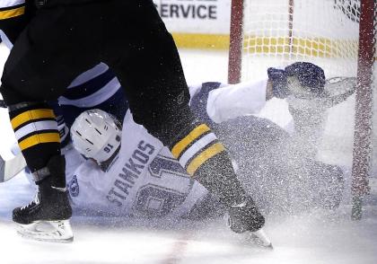 Stamkos crashed into the goal post during a game against the Bruins on Nov. 11, 2013, breaking his leg. (AP)