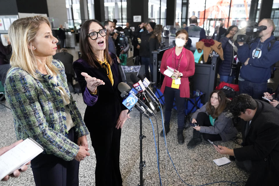 Attorneys for R. Kelly, Jennifer Bonjean, right, and Ashley Cohen talk to reporters at the Dirksen Federal Building after Kelly's sentencing hearing Thursday, Feb. 23, 2023, in Chicago. R. Kelly was sentenced on Thursday to 20 years in prison for child pornography and enticement of minors for sex but will serve all but one of those simultaneously with a 30-year sentence on racketeering and sex trafficking convictions. (AP Photo/Charles Rex Arbogast)