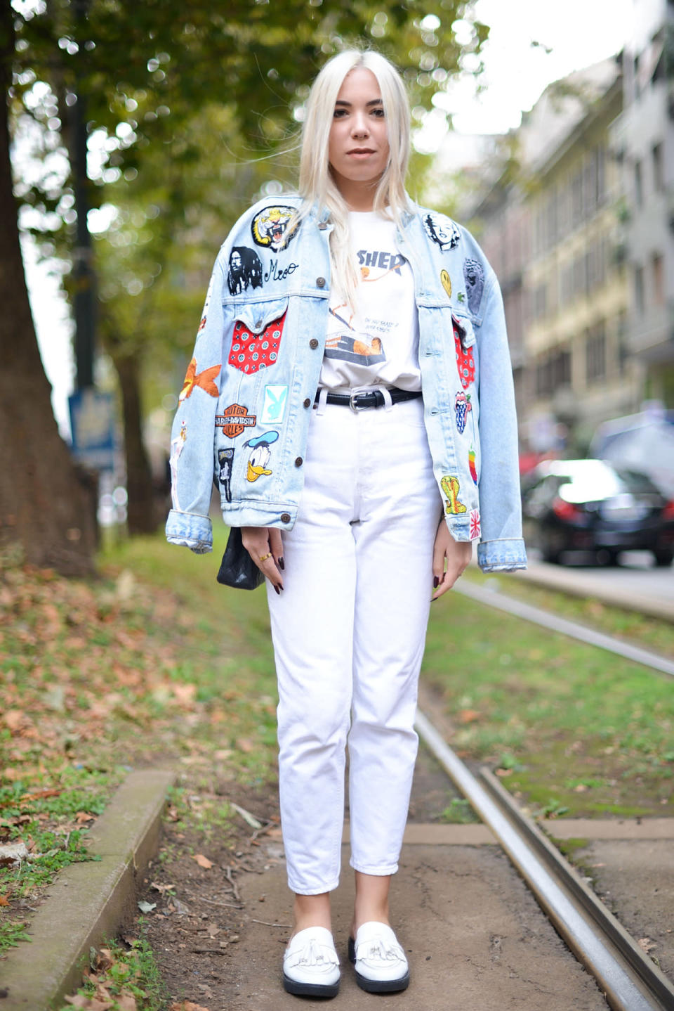 Michela Milesi is casual-cool in patched denim jacket on top of an all-white outfit