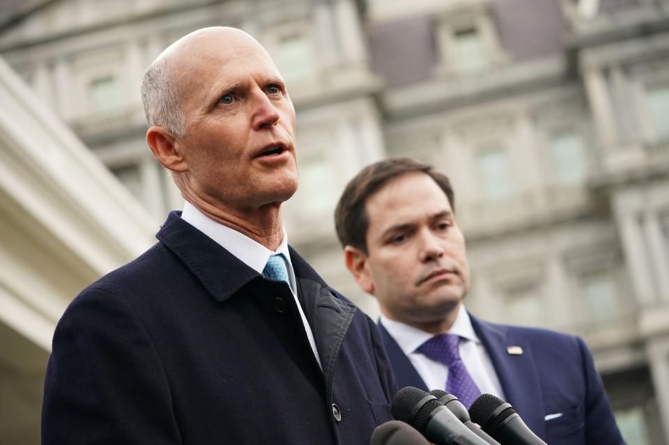 Senators Rick Scott, left, and Marco Rubio.