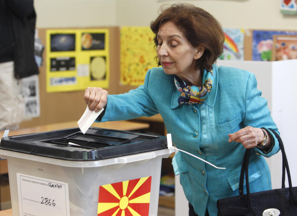 Gordana Siljanovska Davkova, a presidential candidate for the opposition conservative VMRO-DPMNE party, casts her ballot for the presidential elections at a polling station in Skopje, North Macedonia, Sunday, April 21, 2019. North Macedonia holds the first round of presidential elections on Sunday, seen as key test of the government following deep polarization after the country changed its name to end a decades-old dispute with neighboring Greece over the use of the term "Macedonia". (AP Photo/Boris Grdanoski)