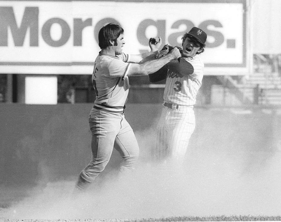 Cincinnati Reds star Pete Rose swings at New York Mets shortstop Bud Harrelson after Rose failed to break up Harrelson's double play in Game 3 of the 1973 National League Championship series at Shea Stadium.