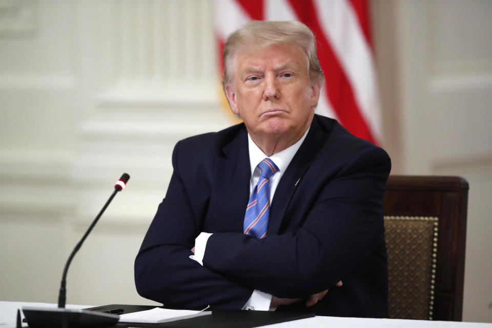 President Donald Trump listens during a "National Dialogue on Safely Reopening America's Schools," event in the East Room of the White House on July 7 in Washington. (Alex Brandon/AP)