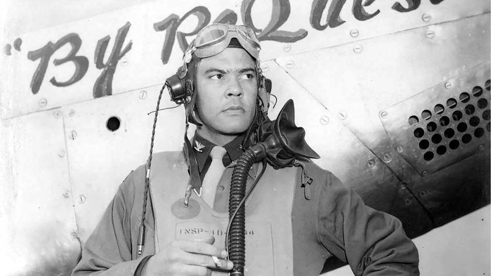 Benjamin O. Davis Jr. stands next to a P-51C Mustang “By Request” airplane, which he flew during World War II as part of the 99th Fighter Squadron, 332nd Fighter Group when unit was based in Italy in 1944. - Chanute Air Museum/Black Privilege Publishing/Simon & Schuster