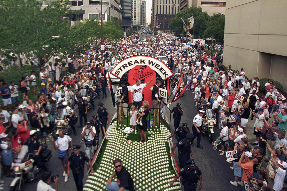 FILE - Baltimore Orioles baseball player Cal Ripken Jr. is joined by his family as he rides in a parade celebrating Ripken's surpassing of Lou Gehrig's record of 2,130 consecutive games, in downtown Baltimore, Md., Sept. 7, 1995. For the first time in 53 years, Baltimore is hosting the AFC championship game, bringing a different kind of spotlight to Charm City this weekend. It's probably the biggest sporting event here since Ripken broke Gehrig's record. (AP Photo/Ted Mathis, File)