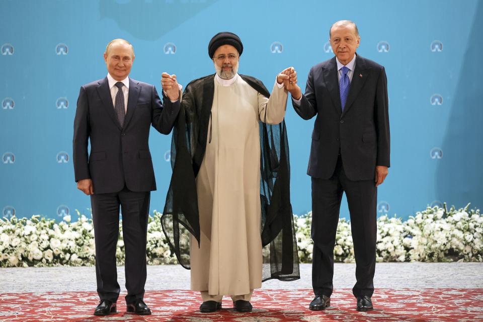 FILE - Russian President Vladimir Putin, left, Iranian President Ebrahim Raisi, center, and Turkish President Recep Tayyip Erdogan pose for a photo prior to their talks at the Saadabad palace, in Tehran, Iran, on July 19, 2022. Erdogan, who is seeking a third term in office as president in elections in May, marks 20 years in office on Tuesday, March 14, 2023. (Sergei Savostyanov, Sputnik, Kremlin via AP, File)