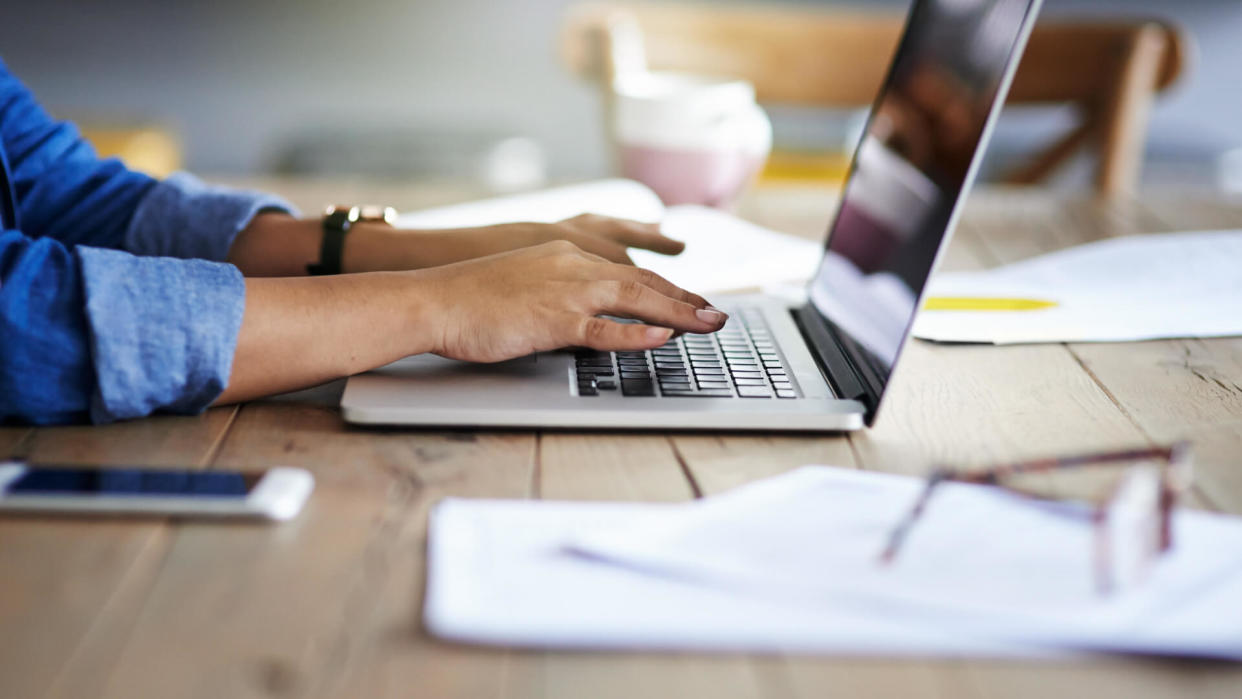 woman using a laptop while working from home