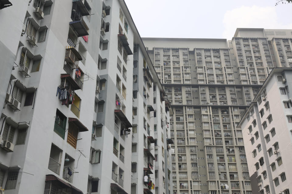 An apartment building is seen on Oct. 9, 2023, in a Kuala Lumpur, Malaysia, neighborhood where Rohingya child brides live. Rohingya girls told The Associated Press they are often locked in their apartments by their husbands. (AP Photo/Victoria Milko)