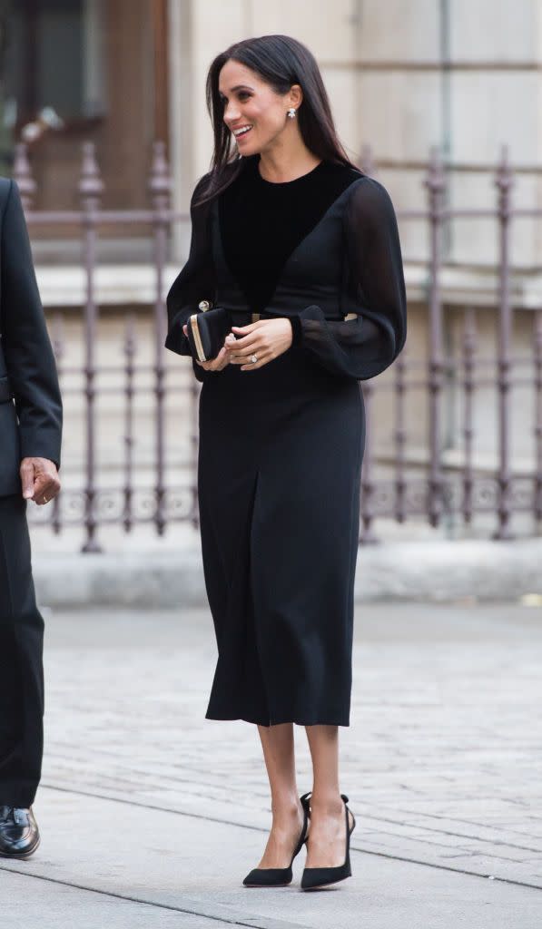 <p><a href="https://www.townandcountrymag.com/style/fashion-trends/a23453834/meghan-markle-first-solo-event-oceania-exhibit-black-dress-givenchy/" rel="nofollow noopener" target="_blank" data-ylk="slk:Meghan Markle wore a sleek black Givenchy dress;elm:context_link;itc:0;sec:content-canvas" class="link ">Meghan Markle wore a sleek black Givenchy dress</a> for her very first solo appearance at the Royal Academy of Arts in London. The Duchess accessorized with a Givenchy clutch and a pair of heels by Aquazzura.</p>