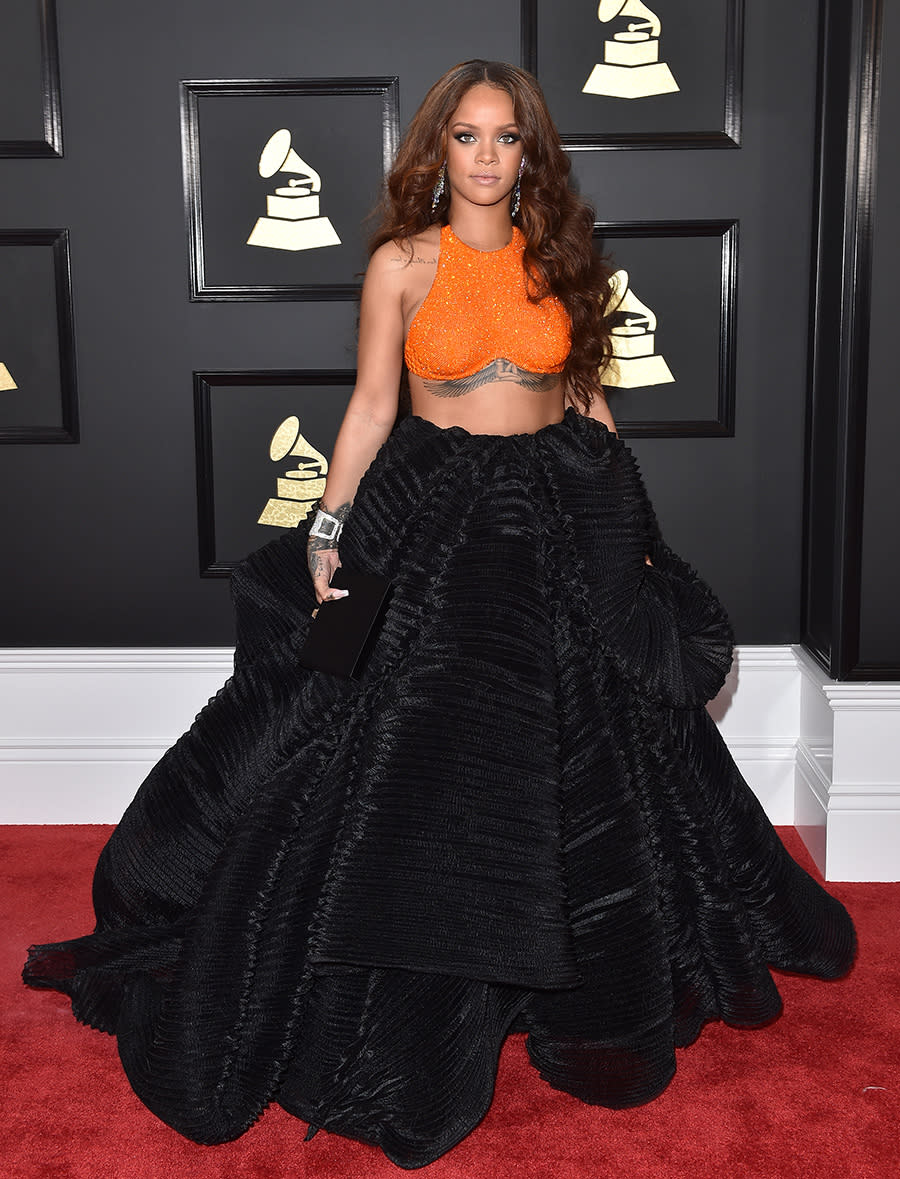 <p>The singer wore an orange-and-black two-piece look from Armani Privé to the 2017 Grammy Awards. (Photo: Getty Images) </p>