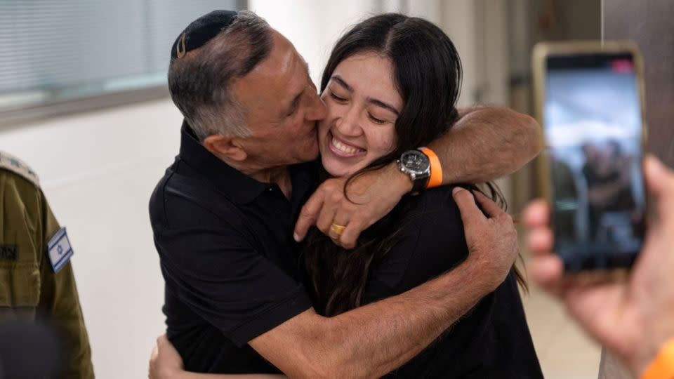Noa Argamani, a rescued hostage, embraces her father, Yakov Argamani, after her rescue from central Gaza by Israeli forces on June 8, 2024. - Israeli Army/Handout/Reuters