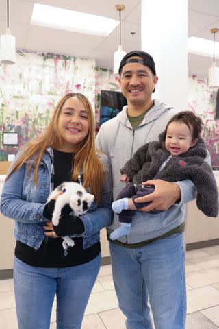 <p>Colleen Barkley/PAWS Chicago</p> Casper the "Marathon Kitten" at PAWS Chicago with the Maldonado family