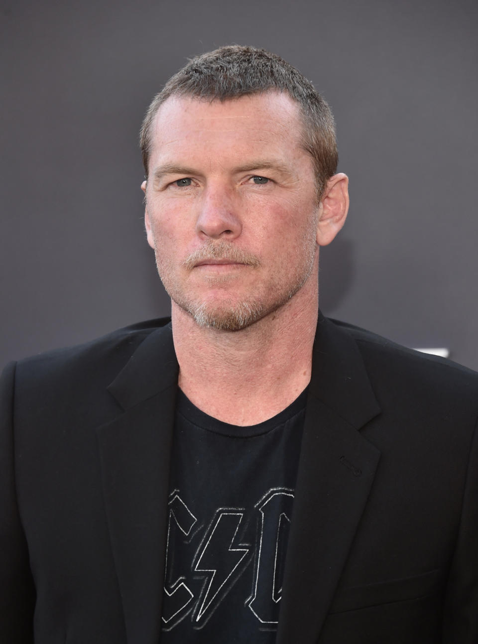 Sam Worthington poses at the "Under The Banner Of Heaven" premiere on April 20, 2022