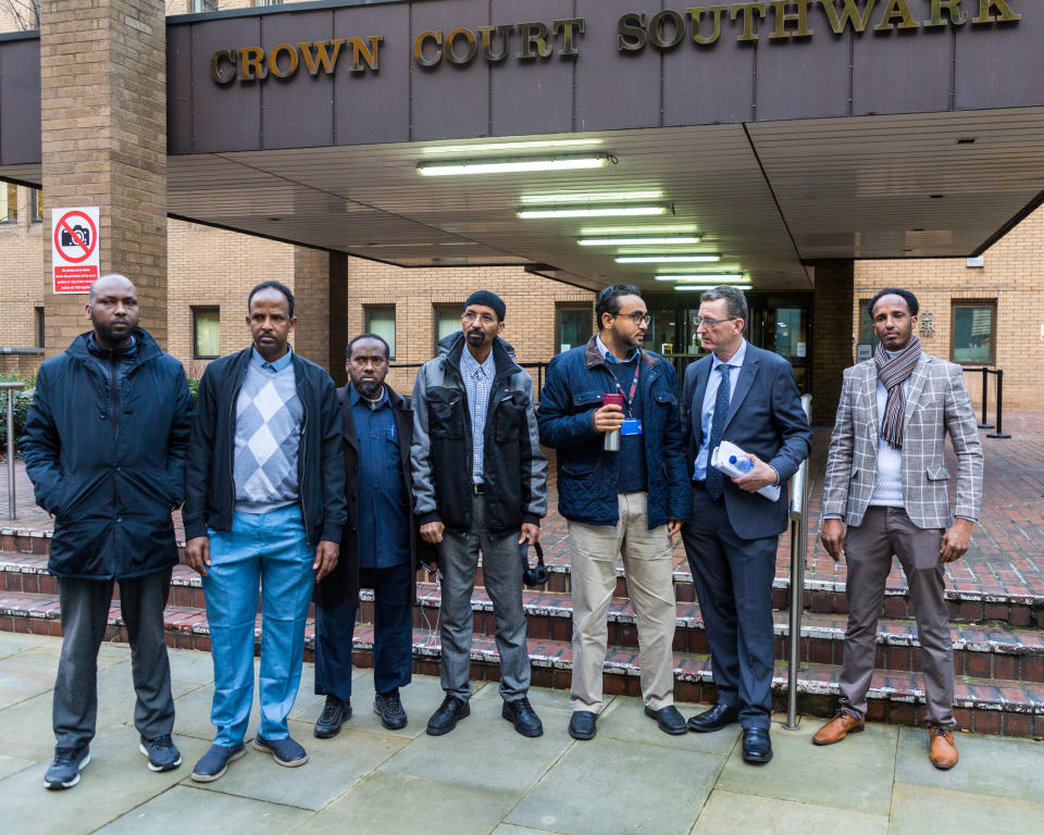 James Farrar, 2nd right, with Uber drivers supporting him, outside Southwark Crown Court in London. London, January 13 2020.    See National News story NNmegaphone