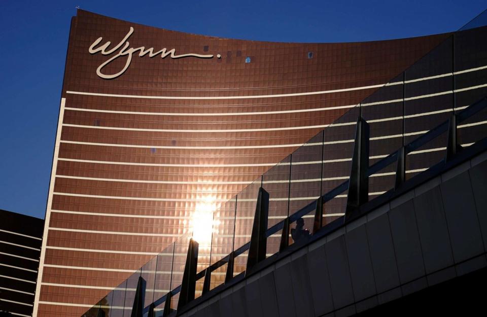 PHOTO: People walk along a pedestrian bridge near the Wynn Las Vegas hotel-casino, Sept. 17, 2020, in Las Vegas. (John Locher/AP, FILE)