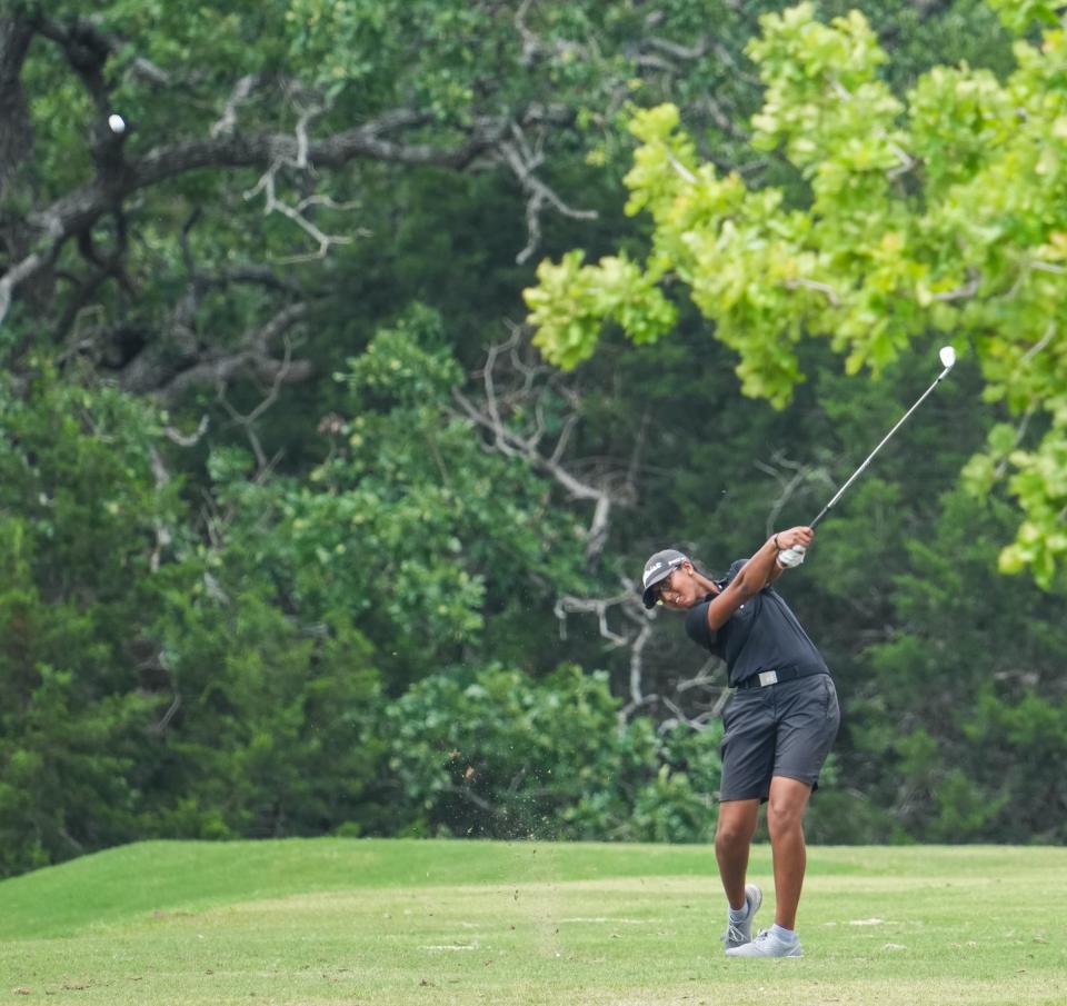 Vandegrift's Swetha Sathish hits a shot during Tuesday's final round of the Class 6A girls UIL state golf championship in Georgetown. Vandegrift won the state title for the second straight year.