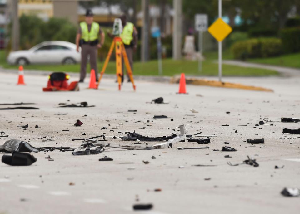 The Florida Highway Patrol investigates a quadruple fatal traffic crash on U.S. 1 north of the Roosevelt Bridge near Northwest Baker Road on Tuesday, Oct. 18, 2022, in Martin County. The crash involved a 2017 red Chrysler minivan and a 2022 black Tesla sedan, each of which were transporting two people. Both drivers and both passengers died, said Martin County Chief Deputy John Budensiek.