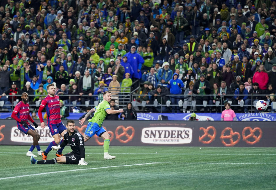 Seattle Sounders midfielder Albert Rusnák, right, watches his goal sail past FC Dallas goalkeeper Maarten Paes, second from right, as midfielder Asier Illarramendi, second from left, and defender Sebastien Ibeagha, left, look on during the first half of Game 3 of a first-round playoff MLS soccer match Friday, Nov. 10, 2023, in Seattle. (AP Photo/Lindsey Wasson)