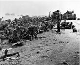 After landing at the shore, these British troops wait for the signal to move forward during the initial Allied landing operations in Normandy, France, on June 6, 1944. (Photo: AP)