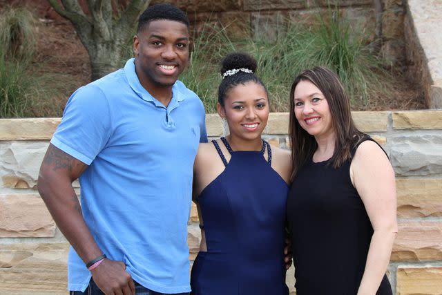 courtesy Walt Harris Aniah Blanchard (center) with her step-father Walt Harris and mother Angela Harris.