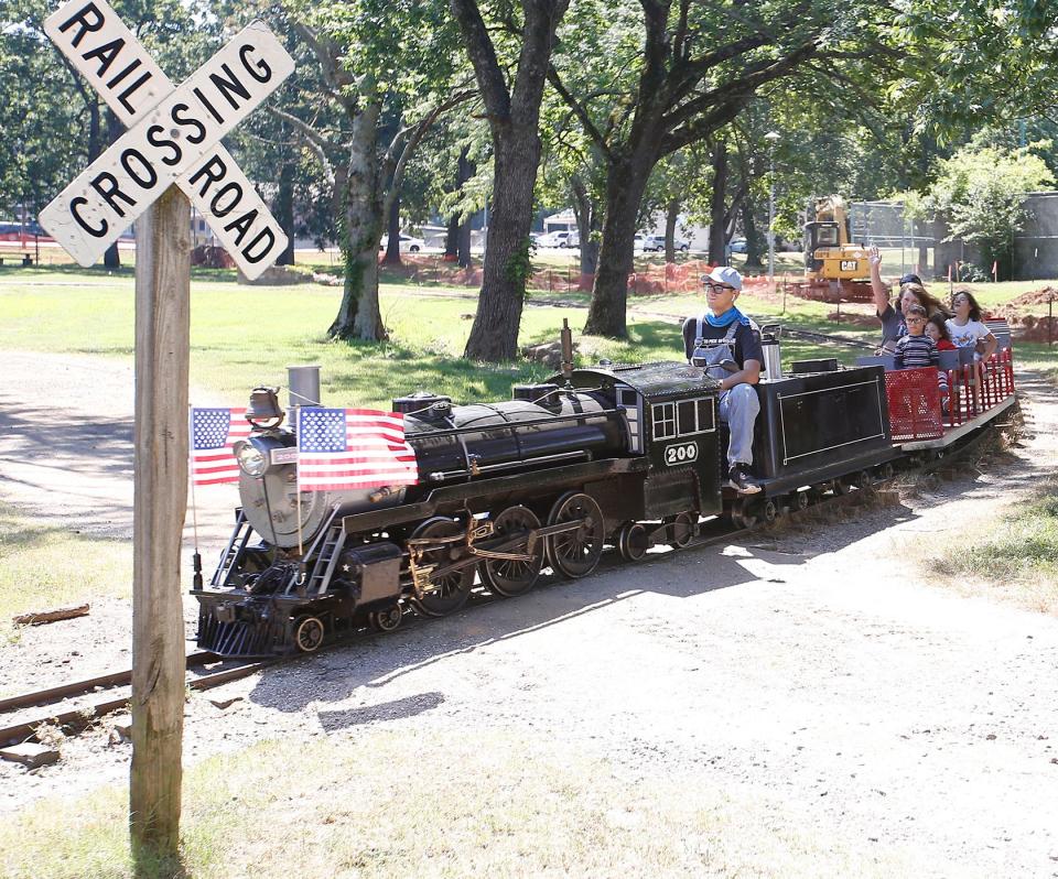 Will Turner brings the 200 Electric Steam Engine into the depot at Creekmore Park after taking the Montoya family around the track on June 30, 2022, in Fort Smith. The train operates Wednesday-Saturday, 10 a.m. to 4 p.m., and on Sundays, 1-6 p.m. until September when the schedule changes to weekend hours.