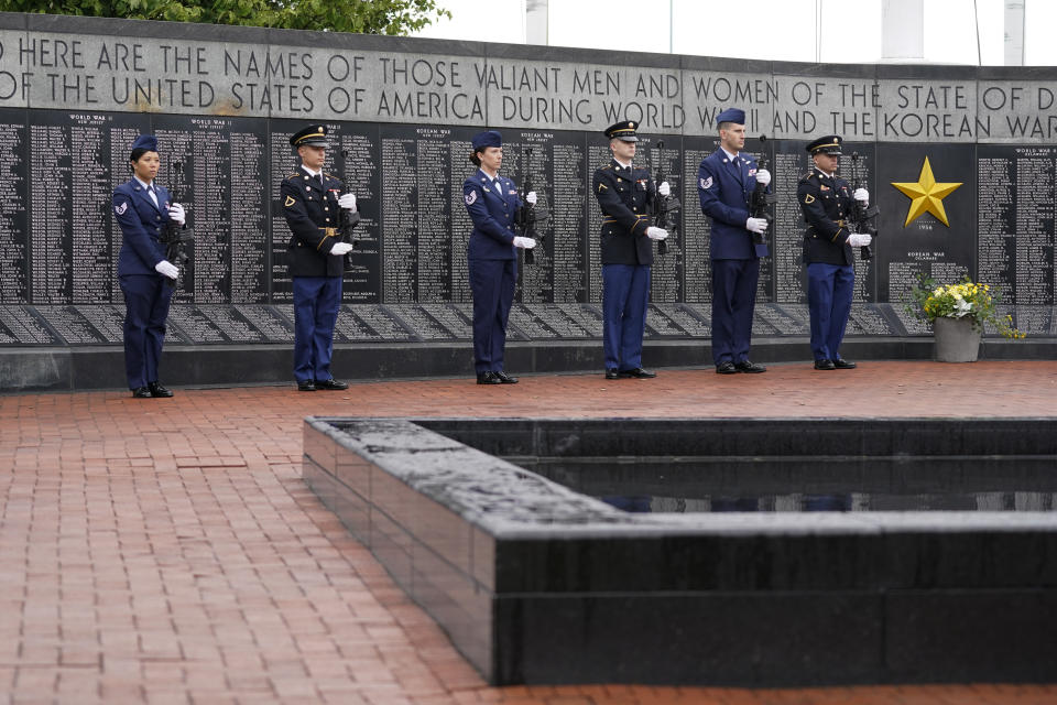 An honor guard stands at attention during a Memorial Day event attended by President Joe Biden at Veterans Memorial Park at the Delaware Memorial Bridge in New Castle, Del., Sunday, May 30, 2021. (AP Photo/Patrick Semansky)