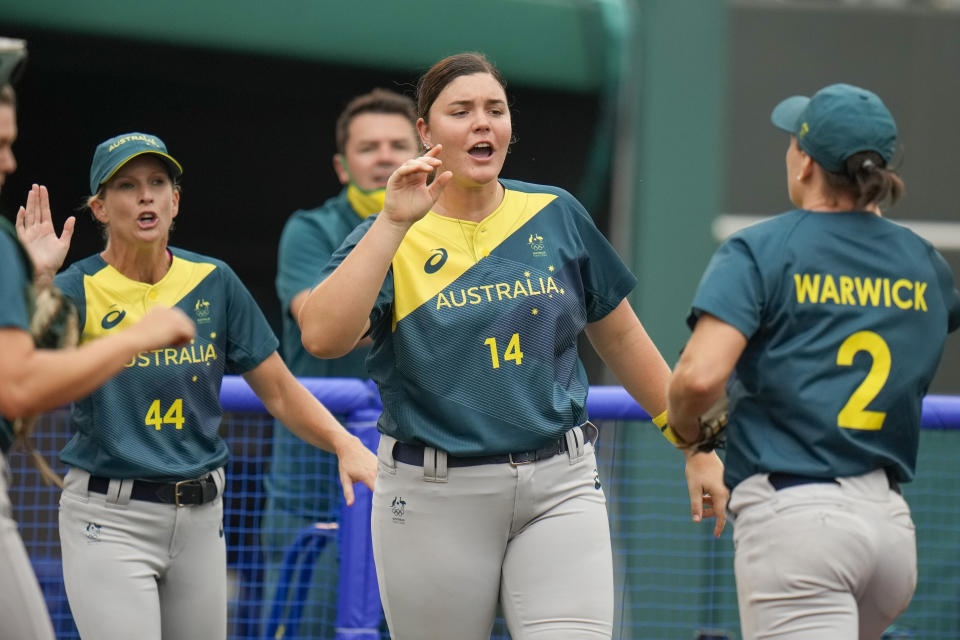 Australia's Tarni Stepto reacts with teammates during the softball game between the Italy and Australia at the 2020 Summer Olympics, Thursday, July 22, 2021, in Fukushima , Japan. (AP Photo/Jae C. Hong)