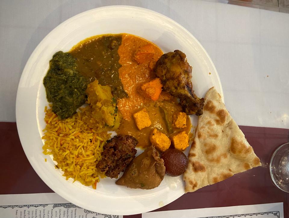 A plate from the lunch buffet at Taste of India on Sunday, Aug. 13. Options include vegetable samosas, butter chicken and palak paneer, among others.