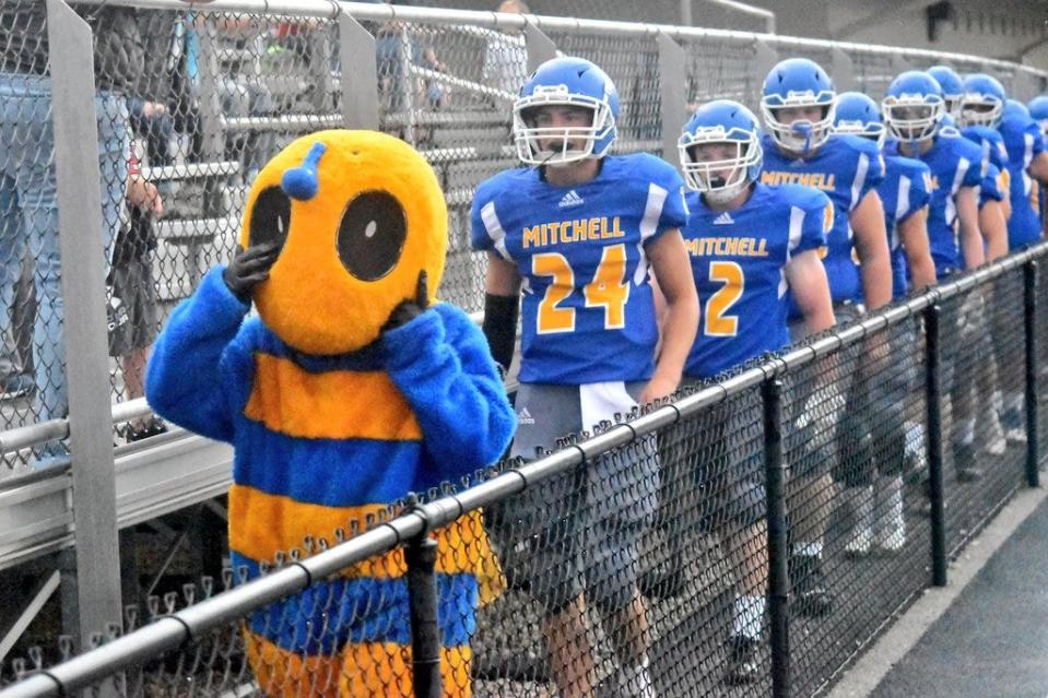 The Mitchell football team strolls by the home stands on its way to the field ahead of its matchup with the Springs Valley Blackhawks last season.
(Photo: Auston Matricardi)